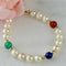 Bracelet Armband en perles, or 14 carats et pierres fines 58 Facettes 2306