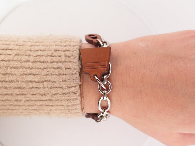Bracelet Hermès Olga Amulette - Bracelet en cuir Barenia et acier palladié 58 Facettes 265386