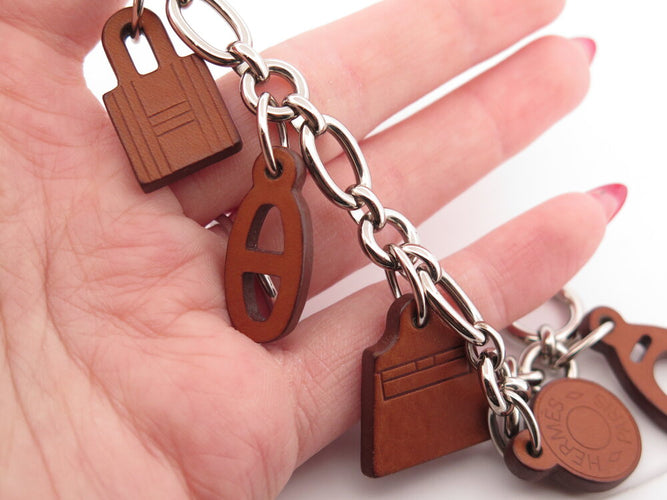Bracelet Hermès Olga Amulette - Bracelet en cuir Barenia et acier palladié 58 Facettes 265386
