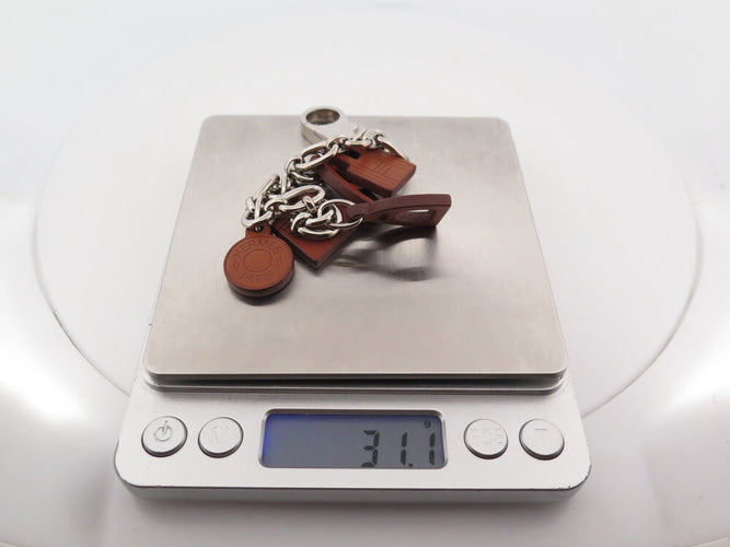 Bracelet Hermès Olga Amulette - Bracelet en cuir Barenia et acier palladié 58 Facettes 265386
