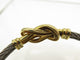Bracelet FRED Force 10 Infinie - Bracelet grand modèle en or jaune 18k et acier 58 Facettes 271707