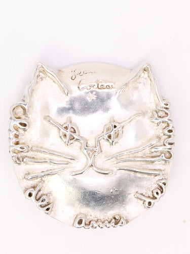 Broche JEAN COCTEAU Broche "Club des Amis des Chats" métal argenté 58 Facettes 1CA0000048/1