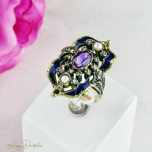 Bague 54 Bague Art nouveau émaillée en or 18K et or blanc, diamants et améthyste 58 Facettes 1725