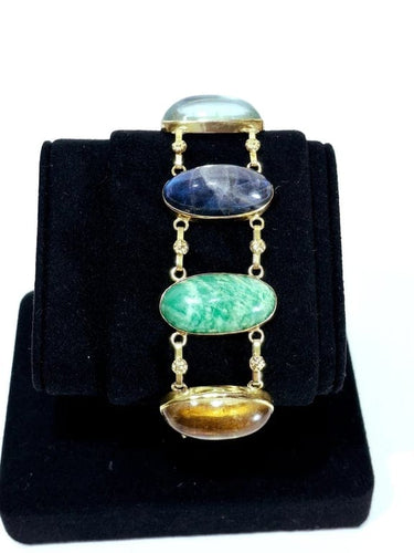 Bracelet Bracelet en or champagne 18 carats à cabochons de pierres fines 58 Facettes