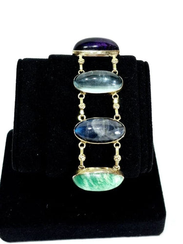 Bracelet Bracelet en or champagne 18 carats à cabochons de pierres fines 58 Facettes