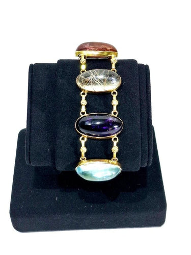 Bracelet Bracelet en or champagne 18 carats et pierres fines cabochon 58 Facettes