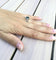 Bague 52 Bague en or blanc 18 carats avec diamants et pierre verte synthétique 58 Facettes