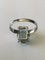 Bague 55 Bague en or blanc 18 carats sertie d’une aigue-marine 58 Facettes 598291