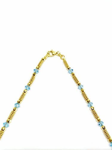 Collier Collier en or jaune 18 carats et perles de verre bleues 58 Facettes