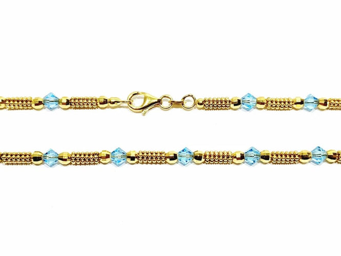 Collier Collier en or jaune 18 carats et perles de verre bleues 58 Facettes
