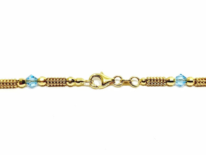 Collier Collier en or jaune 18 carats et perles de verre bleues 58 Facettes