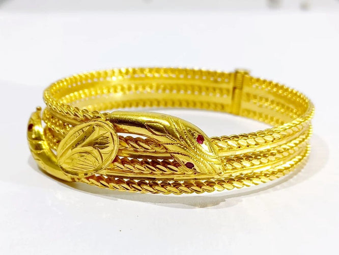 Bracelet Bracelet serpent rigide en or jaune 18 carats et rubis 58 Facettes