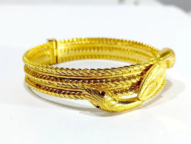 Bracelet Bracelet serpent rigide en or jaune 18 carats et rubis 58 Facettes