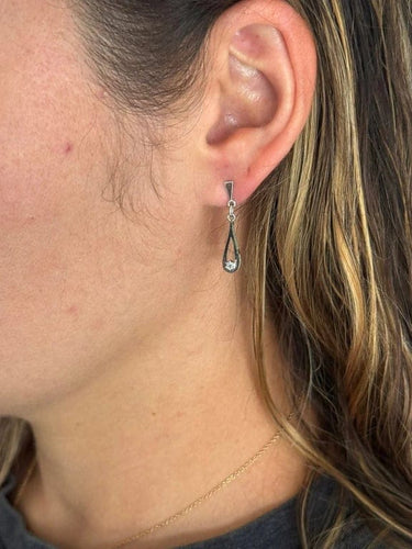 Boucles d'oreilles Boucles d’oreilles en or blanc 18 carats et diamants 58 Facettes