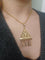 Pendentif Pendentif filigrané en or champagne 18 carats 58 Facettes