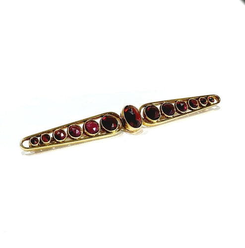 Broche Broche Art déco en or jaune 18 carats et grenats 58 Facettes
