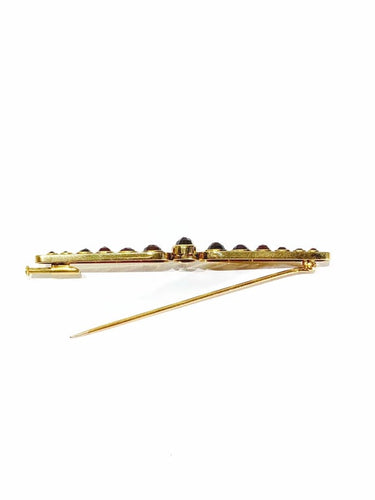 Broche Broche Art déco en or jaune 18 carats et grenats 58 Facettes