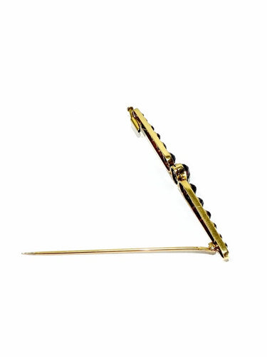 Broche Broche Art déco en or jaune 18 carats et grenats 58 Facettes