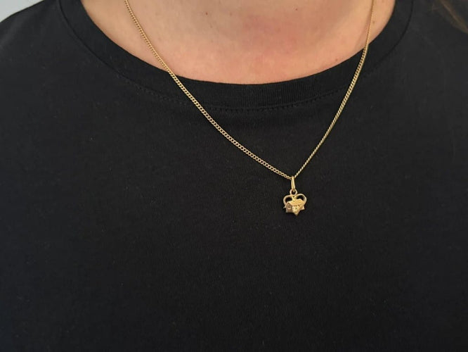 Pendentif Pendentif maison dans un cœur en or rose 18 carats 58 Facettes