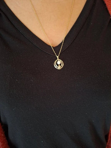 Pendentif Pendentif en or jaune 18 carats et perle 58 Facettes