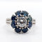 Bague 52 Bague marguerite Art déco en platine avec diamant 0,65 ct et saphirs 58 Facettes A06577