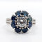Bague 52 Bague marguerite Art déco en platine avec diamant 0,65 ct et saphirs 58 Facettes A06577