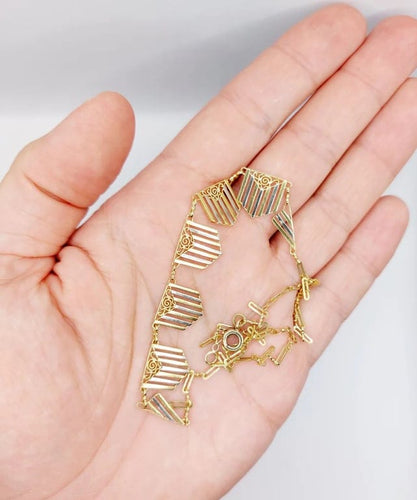 Collier Collier Art déco à motifs filigranés en or jaune et blanc 18k 58 Facettes A04100