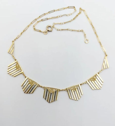 Collier Collier Art déco à motifs filigranés en or jaune et blanc 18k 58 Facettes A04100