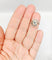 Bague 48 Bague tourbillon ancienne en or 18k et platine, diamants 58 Facettes A06630
