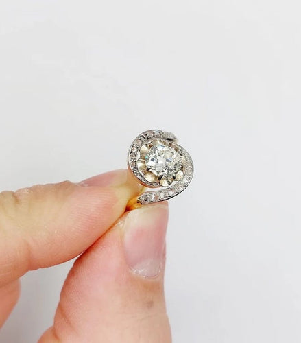 Bague 48 Bague tourbillon ancienne en or 18k et platine, diamants 58 Facettes A06630