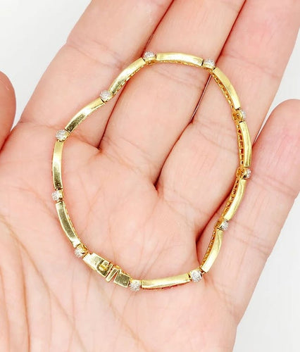 Bracelet Bracelet Art déco en or jaune 18K avec rubis synthétiques et diamants 58 Facettes A05502