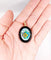 Pendentif Pendentif vintage en or rose 18k avec onyx et plaque émaillée 58 Facettes A06188