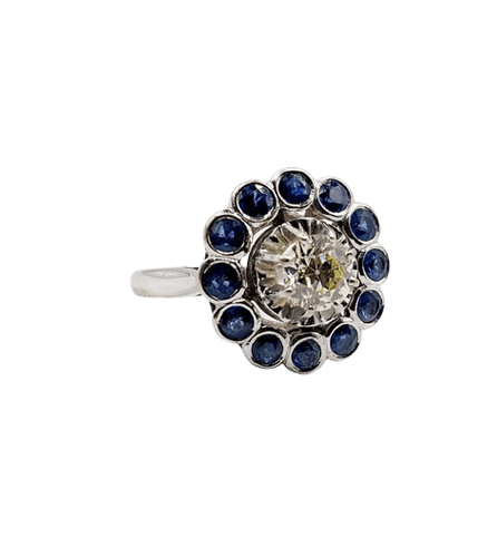 Bague 51.5 Art déco - Bague marguerite en or blanc 18k, diamant 0,65 ct et saphirs 58 Facettes A06329
