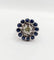 Bague 51.5 Art déco - Bague marguerite en or blanc 18k, diamant 0,65 ct et saphirs 58 Facettes A06329