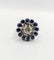 Bague 51.5 Art déco - Bague marguerite en or blanc 18k, diamant 0,65 ct et saphirs 58 Facettes A06329