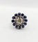 Bague 51.5 Art déco - Bague marguerite en or blanc 18k, diamant 0,65 ct et saphirs 58 Facettes A06329