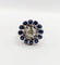 Bague 51.5 Art déco - Bague marguerite en or blanc 18k, diamant 0,65 ct et saphirs 58 Facettes A06329
