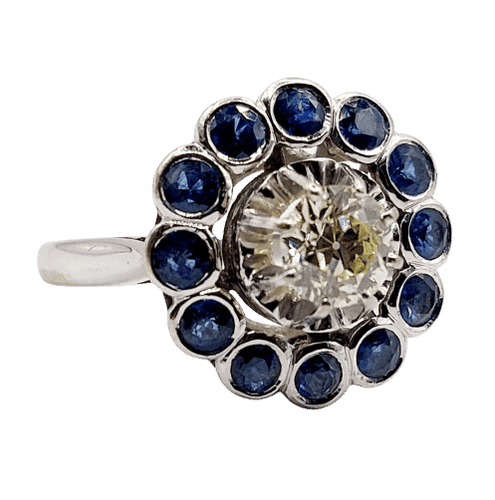Bague 51.5 Art déco - Bague marguerite en or blanc 18k, diamant 0,65 ct et saphirs 58 Facettes A06329
