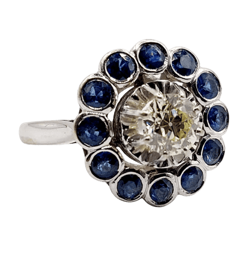 Bague 51.5 Art déco - Bague marguerite en or blanc 18k, diamant 0,65 ct et saphirs 58 Facettes A06329