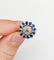 Bague 51.5 Art déco - Bague marguerite en or blanc 18k, diamant 0,65 ct et saphirs 58 Facettes A06329