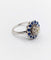 Bague 51.5 Art déco - Bague marguerite en or blanc 18k, diamant 0,65 ct et saphirs 58 Facettes A06329