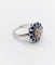 Bague 51.5 Art déco - Bague marguerite en or blanc 18k, diamant 0,65 ct et saphirs 58 Facettes A06329