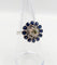 Bague 51.5 Art déco - Bague marguerite en or blanc 18k, diamant 0,65 ct et saphirs 58 Facettes A06329