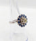 Bague 51.5 Art déco - Bague marguerite en or blanc 18k, diamant 0,65 ct et saphirs 58 Facettes A06329