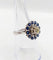 Bague 51.5 Art déco - Bague marguerite en or blanc 18k, diamant 0,65 ct et saphirs 58 Facettes A06329