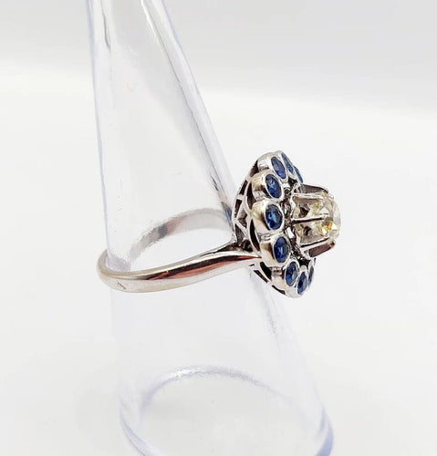 Bague 51.5 Art déco - Bague marguerite en or blanc 18k, diamant 0,65 ct et saphirs 58 Facettes A06329