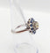 Bague 51.5 Art déco - Bague marguerite en or blanc 18k, diamant 0,65 ct et saphirs 58 Facettes A06329