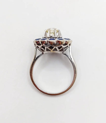 Bague 51.5 Art déco - Bague marguerite en or blanc 18k, diamant 0,65 ct et saphirs 58 Facettes A06329
