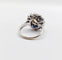 Bague 51.5 Art déco - Bague marguerite en or blanc 18k, diamant 0,65 ct et saphirs 58 Facettes A06329