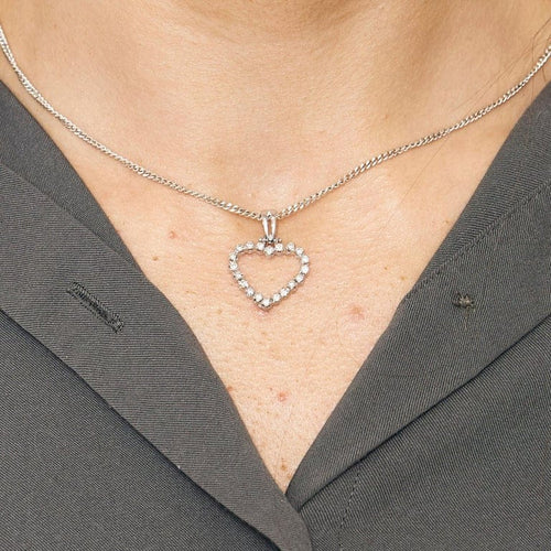 Pendentif Pendentif cœur en or blanc et diamants 58 Facettes LP1148